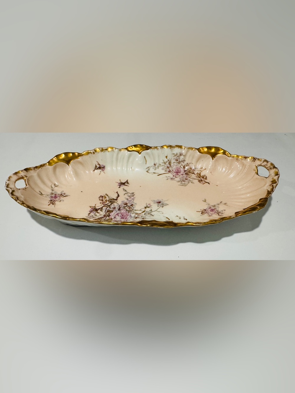 Antique Limoges French porcelain tray with a floral design and gold tone trim